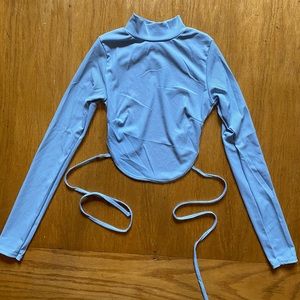 Baby blue trendy cropped turtleneck with open back